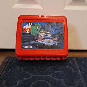 This is a vintage 1989 Ghostbusters II red plastic lunchbox made by Thermos. 